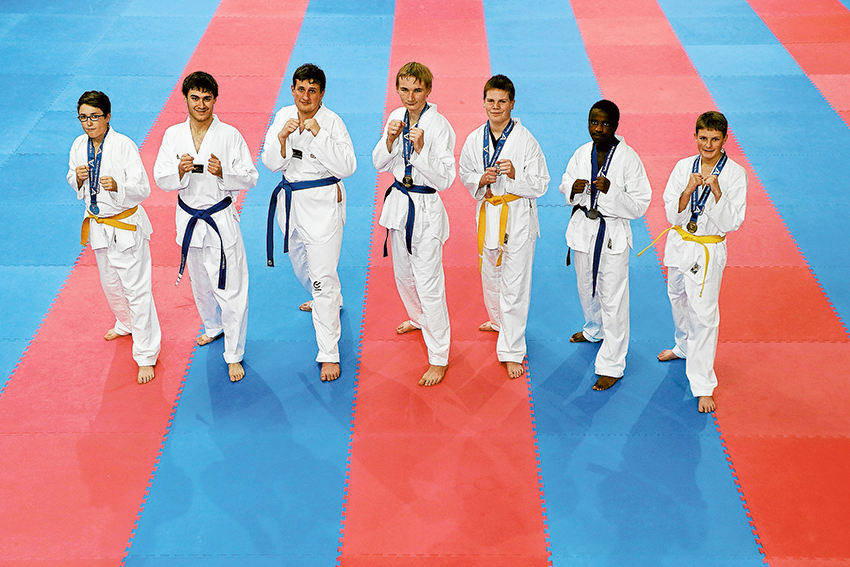 WELL FOUGHT MEDAL WINS… From left, Koryo Taekwondo students, Aden (silver), Anthony (bronze), Dom (gold), Brandon (gold), Taylan (bronze), Rishari (silver) and Jed (gold) each came away with medals after competing in the Taekwondo Victoria Inc 2018 TVI Winter Invitational recently. Photo: David Lee.