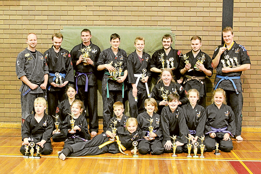 MARTIAL ARTS SUCCESS... From left (back), Soaring Eagle Dojos Sensei Michael Parnell, students, Jereb King, Greg Clarkson, Lucas Fenby, Jeremy Nunn, Samuel Slorach, James Gedye and Toby King. (Middle), Joy Parnell and Liesl Parnell. (Front), Tyron Mustey, Cantelle Moss, Owen Moss, Charlotte Parnell, Caelyn Crozier, Ethan Moss, Juna Crozier, Emily Moss. Photo: Supplied.