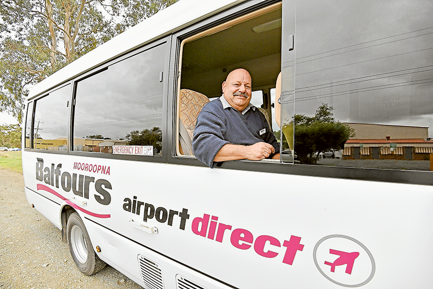COMFY, STRESS-FREE TRAVEL… Balfours Airport Direct driver, Neil Verhoeven showing off one of the Balfours buses. Photo: Sharelle Jarvis.