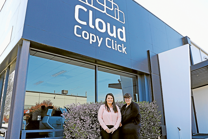 Smart business solutions… From left, Cloud Copy Click business mobility specialists, Hailey Saunders and Jade Parker. Photo: Katelyn Morse.