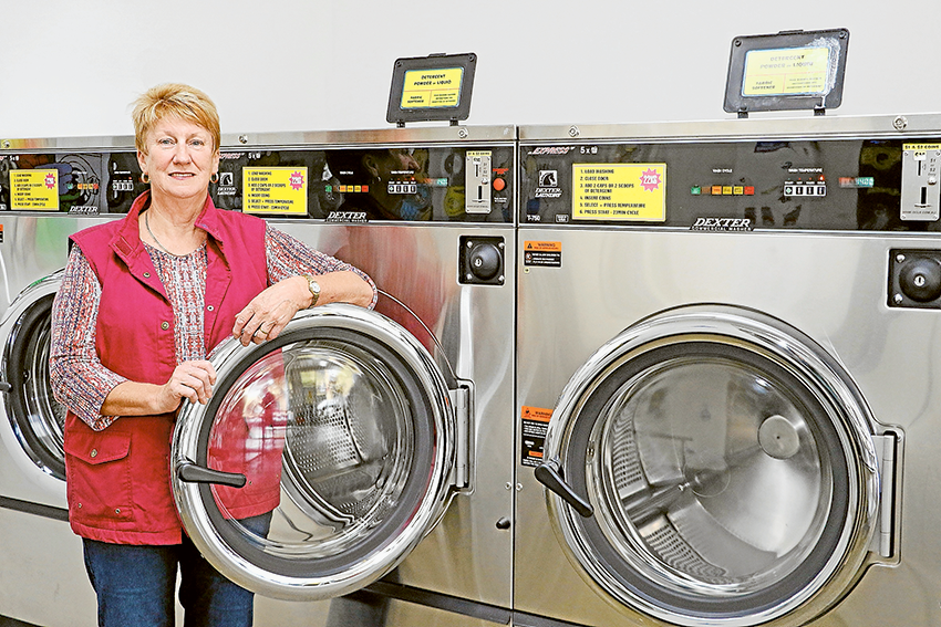 THE ONE STOP LAUNDROMATS… Noelene Caverzan in front of one of the large washing machines, which is only part of the services on offer at Shepparton Laundromat. Photo Katelyn Morse.