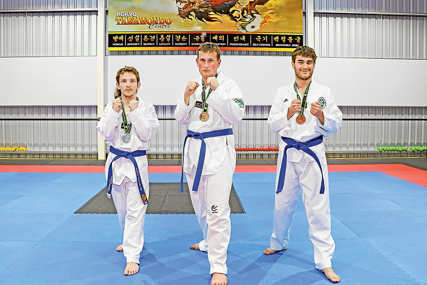 MEDAL WINNING PERFORMANCES… From left, representatives of Shepparton Access and Koryo Taekwondo students, Damon Vasterink (silver), Dom Barlo (gold) and Anthony Buonomo (bronze) have come away from the Taekwondo National Championships with medals. Photo: Katelyn Morse.