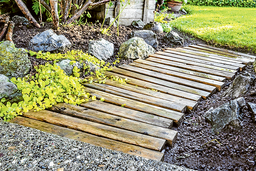 SPRUCE UP YOUR GARDEN... Give your garden area a facelift by building your own wooden walkway. Photo: Supplied.
