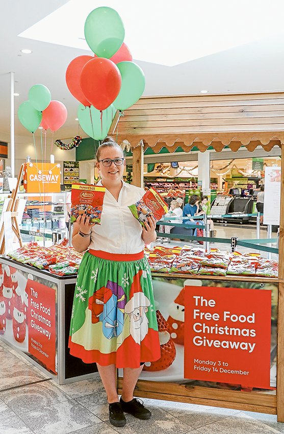 HAPPILY HELPING FOR THE HOLIDAYS… Eva-Rose Davis from Enchanted Rainbow handing out lollies at the Shepparton Marketplace as part of their Free Christmas Food Giveaway. Photo: Katelyn Morse. 