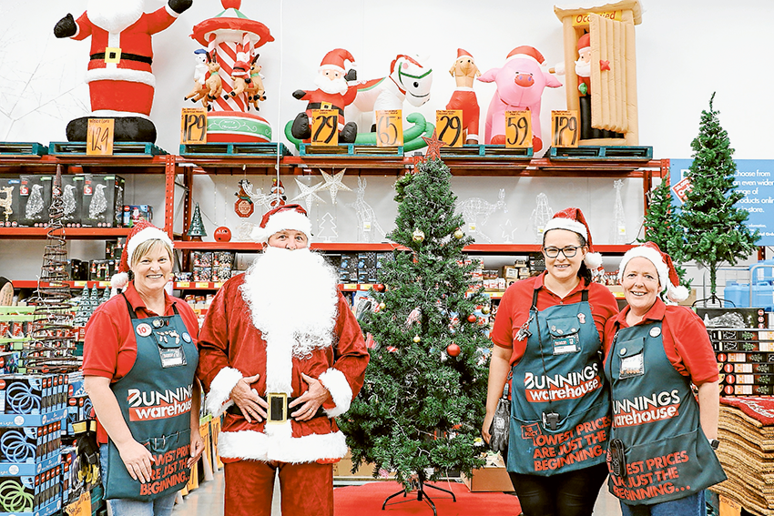 FREE FAMILY FUN… From left, Bunnings Shepparton team member, Robyn Baker, the big man himself, Santa Claus, activities organiser, Jillian Goodman and trade specialist, Didy Wenzke are encouraging families to come along to the Christmas Family Night. Photo: Katelyn Morse.