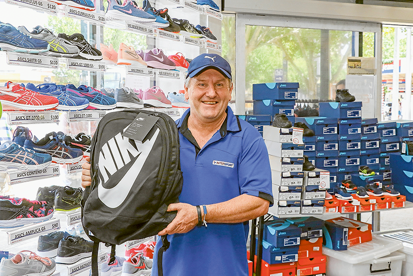 STOCKED UP WITH SCHOOL SUPPLIES… Intersport Shepparton store manager, Gary Harvey has plenty of school shoes, socks, bags and drink bottles. Photo: Katelyn Morse.