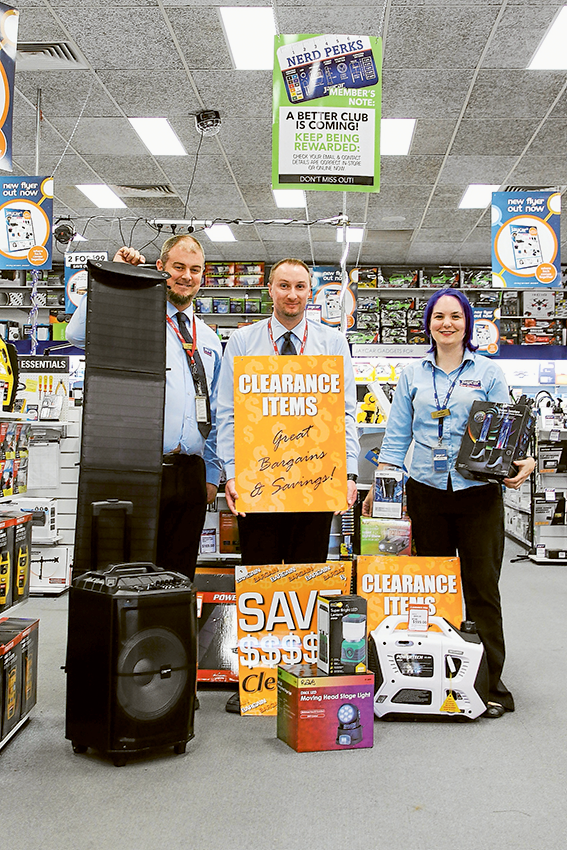 BUMPER BARGAINS… From left, Jaycar Electronics store manager, Chris Lane, assistant manager, Kyle Inifer and duty manager, Jaclyn Williams are deep in preparations for their enormous car park clearance sale this weekend. Photo: Ash Beks.