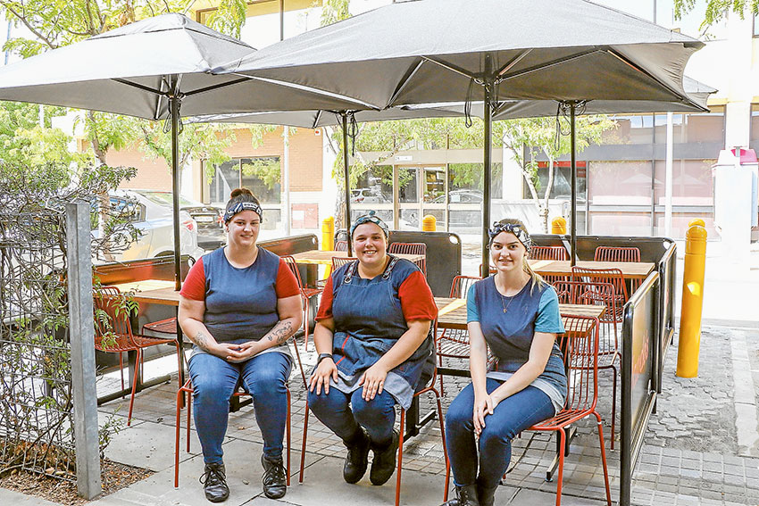 NEW OUTDOOR DINING AREA… From left, Nando’s Shepparton team members, Olivia Viney, Chyenne Donnelly and Shinae Harrison are excited that renovations are completed in the store and on their new outdoor space. Photo: Katelyn Morse.