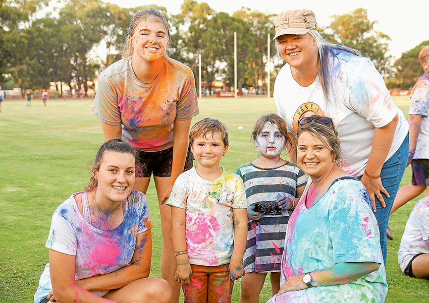 FAMILY FUN TO LAUNCH SEASON… From left, Liv Quattrochi, Grace Jackson-Kightly, Carter Williams and Evie Patten-Boers, Bec Miller and Meg Williams enjoying the Stanhope Football Netball Club colour run. Photo: Supplied.