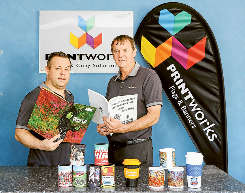 SPEEDY EXPERT SERVICE… From left, Printworks graphic designer, Aaron Palmer and Printworks business owner, Ken Faulkner proudly showcasing just a small range of their services offered. Photo: Katelyn Morse. 