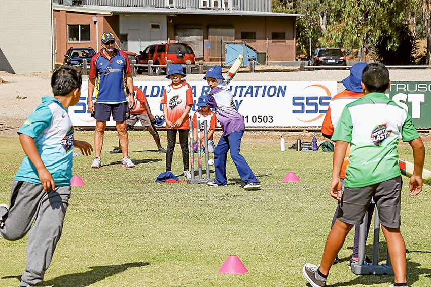 FUN ON THE PITCH… Shepparton English Language Centre primary school students joined secondary school students on the cricket pitch recently to take part in special cricket clinics. Photo: Katelyn Morse.