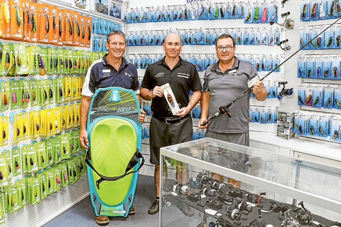 WAY MORE THAN BOATS AND FISHING… From left, Boats & More retail manager, Mike Scandolera, owner, Simon Ryan and resident fishing guru, Terry Phillips showcasing their vast range of stock. Photo: Katelyn Morse.
