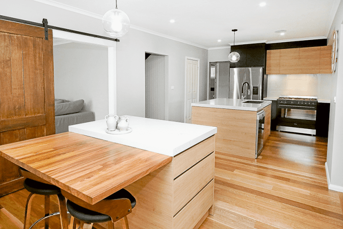 ADV---Liberty-Kitchens-2 STYLISH, SLEEK, UNIQUE … The distinctive design opens up the kitchen area nicely at Amanda-Jean White and Campbell Marx’s newly renovated space, thanks to Liberty Kitchens. Photo: Katelyn Morse.