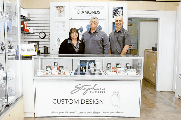 ADV---Stephens-Jewellers SHINE BRIGHT LIKE A DIAMOND… From left, Stephens Jewellers Fryers Street retail sales manager, Nancy May, owner, Stephen Schneider and operations manager, Frank Sagoleo. Photo: Katelyn Morse.