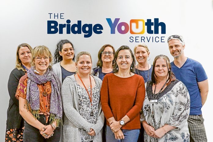 FOCUS ON HELPING THE YOUTH… From left, The Bridge Youth Services integrated family services worker, Rebecca Slade, navigator support worker, Lauren Barker, cradle to kinder worker, Vicky Vourgaslis, youth and family support worker, Emma Dahlenburg, cradle to kinder worker, Linda King, CEO, Melinda Lawley, services manager, Leigh Nash, youth and family support worker, Skye Hudson and integrated family services worker, Stephen Hunter. Photo: Katelyn Morse.