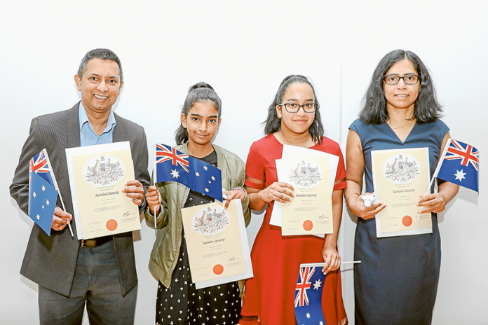 SWORN IN AS AUSTRALIANS… From left, among those sworn in as Australian citizens were family members, Anthony Joachim, Angela Joachim, Lydia Joachim and Kavitha Joachim from Sri Lanka. Photo: Katelyn Morse.