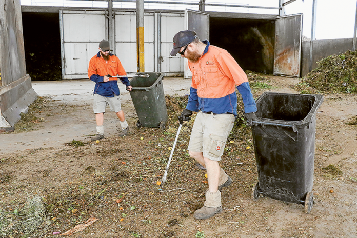 EXCELLENT RESULTS… From left, Western Composting staff members, Greg Miller and Tim Piastri on site at the recycling and composting plant in Shepparton, which has seen a record low rate of contamination for October. Photo: Katelyn Morse.