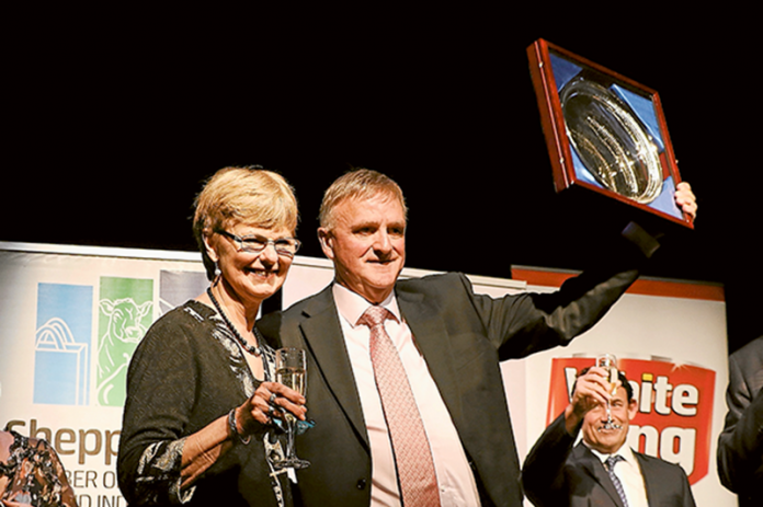 HONOURED FOR RECOGNITION… Dale Wright and wife, Lorraine on stage at the 2018 White King-Pental 95.3 Triple M Business Awards Gala Dinner, where Dale Wright Portrait Maker was announced as this year’s Hall of Fame recipient. Last year’s Hall of Fame inductee, Michael Kearney from Purdeys Jewellers presented Dale and Lorraine with the award. Photo: David Lee.