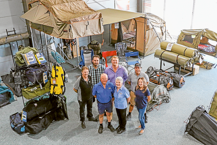 SUMMER IS SORTED… From left, Jeff’s Shed team members, Don Matthews, Atha Petikopoulos, Jeffrey Wickham, Ryan Ivill, Barbara Wickham, Shannon Lancaster and Amy Lancaster in their huge store full of great Christmas gifts for those who love the outdoors. Photo: Katelyn Morse.