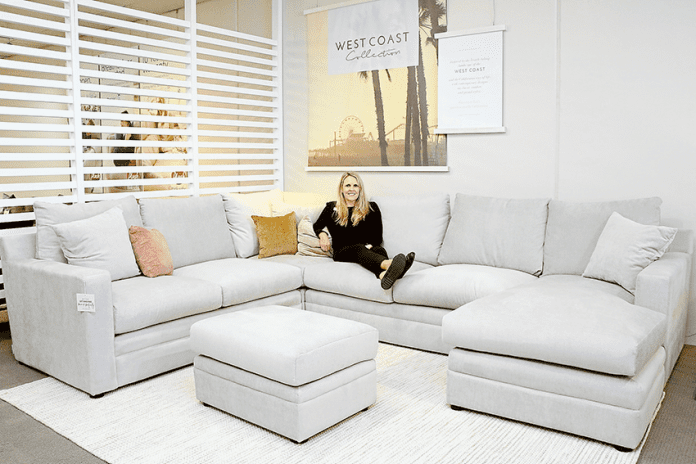 STYLISH COMFORT… Plush Shepparton 2IC, Danielle Cassidy enjoys a relaxing moment on one of their stunning sofas. Photo: Katelyn Morse.