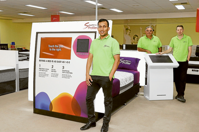 DON’T SLEEP ON DISCOMFORT… From left, Snooze franchise partner, Chetan Patel, store manager, Santo Rimato and sleep consultant, Lyndon Poole are experts in ensuring you get a good night rest. Photo: Alicia Niglia.