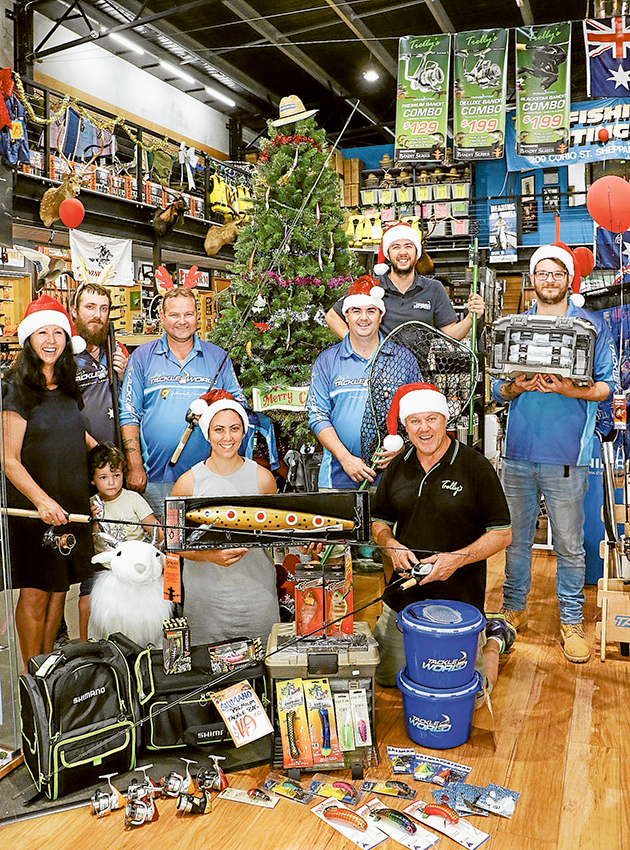 ADV---Trellys STACKS OF STOCK FOR SANTA… From left (back), team members, Brad Seiter, Shane Jones, Glen Smith, Ross Threlfall, Nick Hillman. (Front), owner, Mary Threlfall, 3-year-old, Charlie Threlfall, team member, Jaclyn Threlfall and owner Steve Threlfall are here to help you hook the perfect gift for Christmas. Photo: Katelyn Morse.