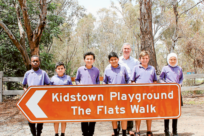 ED---Kidstown-Flats IDEA BROUGHT TO LIFE… From left, Wilmot Road Primary School students, Mechac Vyizigiro, Mortada Alkarawi, Zabihullah Haidari, Amir Navazi, Greater Shepparton City Council CEO, Peter Harriott, Wilmot Road Primary School students, Tanner Webber and Farzana Khademi. Photo: Supplied.