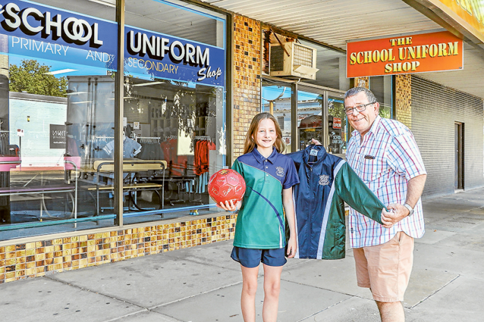 ALL AT ONE CONVENIENT LOCATION… From left, Wanganui Park Secondary College year 7 student, Stephanie Beveridge, with The School Uniform Shop proprietor, Geoff Bray, check out the awesome new uniforms. Photo: Katelyn Morse.