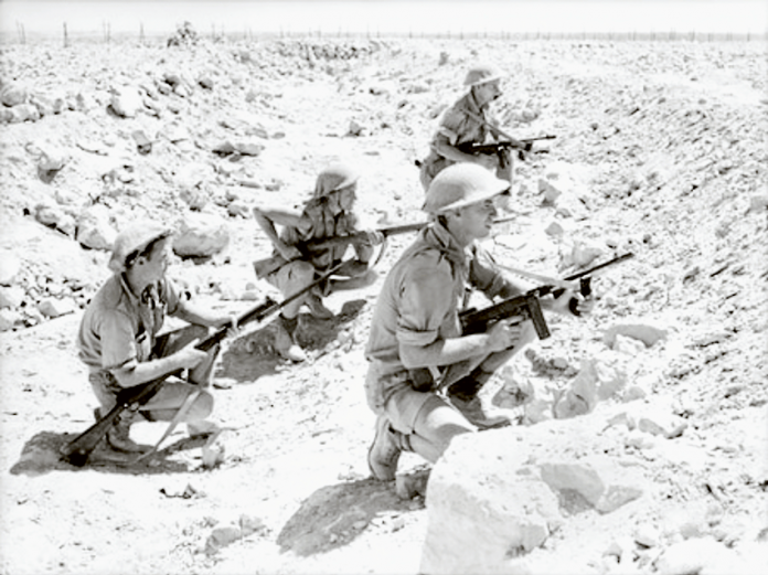 THE MIGHTY RATS OF TOBRUK… Tobruk, Libya. 1941. A small patrol from the 2/13th Infantry Battalion waiting in a tank ditch for a favourable opportunity to go further ahead into ‘no-man's-land.’ Photo: Supplied.
