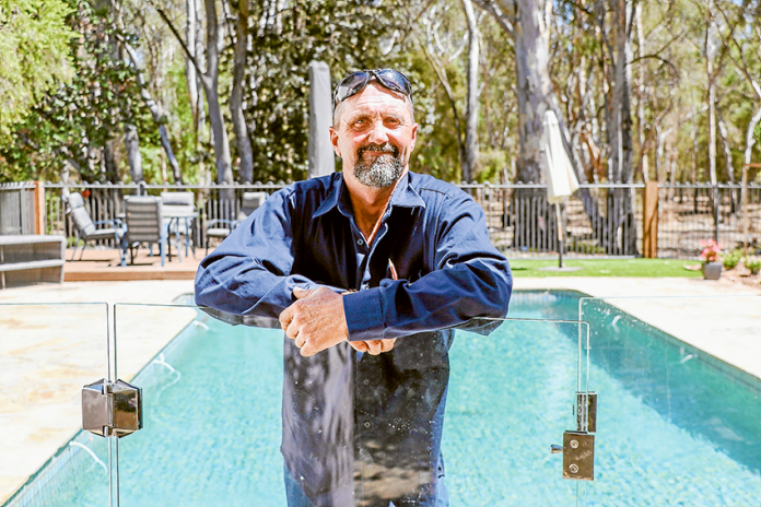 STYLISH SECURITY… Phil Lenon from A & G Custom Fencing is your local expert on glass pool fencing. Photo: Katelyn Morse.
