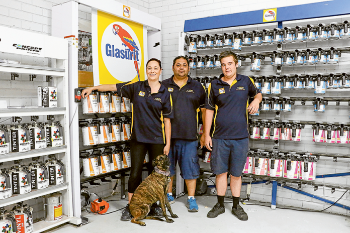 PRICELESS PAINT PERFECTION… … From left, Darby’s Paints Shepparton store manager, Megan Brown, sales representatives, Andrew Cianco and Kyle Lines and store mascot, Molly. Photo: Katelyn Morse.