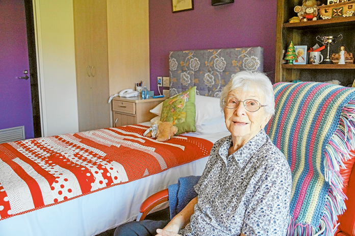 NO PLACE LIKE HOME… Maculata Place resident, Helen Bertram enjoys her special new room at the new, $34M Shepparton Villages’ facility. Photo: Supplied.