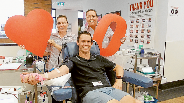 HELPING SAVE LIVES… Shepparton Blood Donor Centre staff members, Di Mark and Jess Casey with local resident, Mathieu Ryan, who made his 50th whole blood donation on Friday last week. Photo: Supplied.