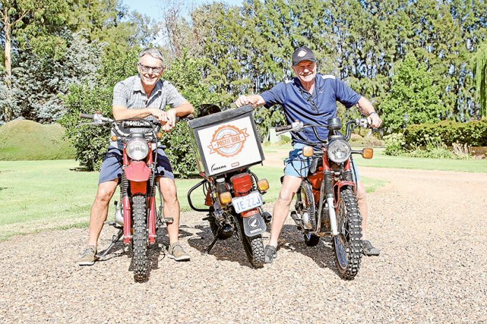 GET ON YOUR BIKE… From left, Great Murray River Postie Bike Alpine Adventure riders, Andrew Prentice and Tom Garrett are part of a local group taking on a three-day ride to help raise funds for cancer support services. Photo: David Lee.
