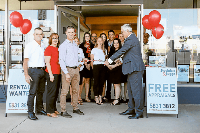 BIG MOVE AFTER 20 YEARS… From left (back), Stockdale & Leggo property manager/administration, Debbie Wiltshire, residential property manager, Kia Rogers, residential property manager, Colin Theobald, commercial property manager, Jessica Tassoni, reception/administration, Mia Beks, residential and commercial sales, Vince Tassoni, sales support, Casey Eckel, property manager/administration, Linda Matthews and sales administration, Katie Lewis. (Front), Stockdale & Leggo senior sales and chattels valuer, Darren Butler, senior property manager, Fiona Butler, managing director, Scott Butler cutting the ribbon to officially open the business’ new premises with Federal Member for Murray, Damian Drum. (Absent), Stockdale & Leggo property manager, Glenys Overwater, property manager/administration, Melissa Mennen. Photo: David Lee.
