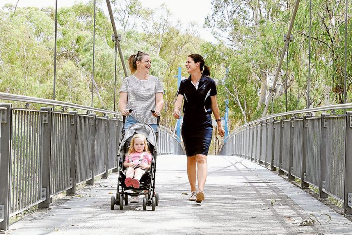 ADV---Activities-in-the-Park TREMENDOUS TWILIGHT STROLL… Local resident, Brooke Hodgetts and daughter, Ivy with Greater Shepparton City Council Healthy Community Officer, Katie Thorp. Photo: David Lee.