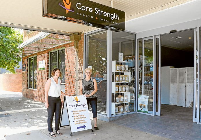 CONVENIENT WORKOUT… From left, Core Strength Health & Wellness receptionist, Natalie Cerasi and manager, Tracey Visser can help you conveniently get in shape with a power-assisted workout. Photo: Katelyn Morse.