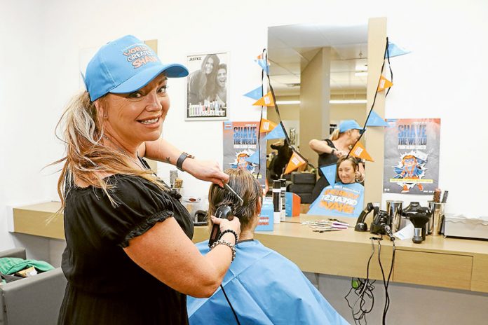 SHAVE FOR CHANGE… From left, Just Cuts Shepparton stylist, Ursula Ballis prepares for the Worlds Greatest Shave with customer, Fiona Sue. Photo: Katelyn Morse.