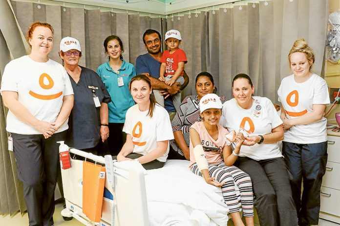 ED---GV-Health-Happy-Day ALL FOR THE KIDS… From left, GV Health registered nurse, Danielle Edis, clinical nurse specialist, Helen Murphy, TAFE student, Prue Bester, nursing educator, Laura Ward, residents, Jagraj Singh, Harshvir Singh, Jasvir Kaur, patient, Jasmeen Kaur, GV Health associate nurse unit manager, Veronica Antonello and registered nurse Brittany Impey at the special afternoon tea held in the children’s ward last week as part of the Koala Kids Foundation International Day of Happiness. Photo: Katelyn Morse.