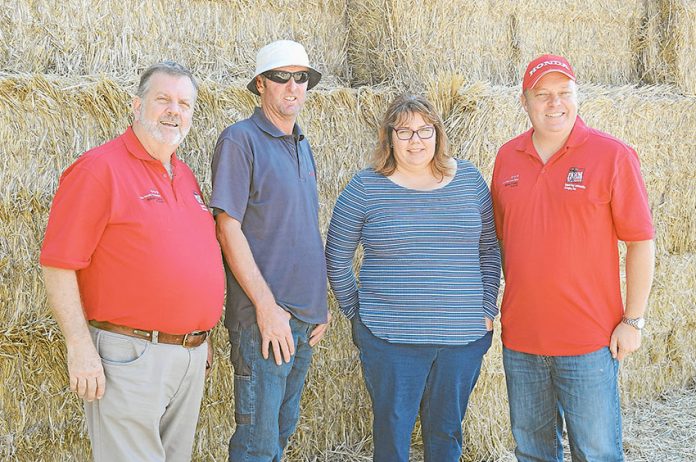 A HELPING HAND… From left, Rural Aid general manager, Wayne Thomson, dairy farmers from Undera, Raymond and Sarah Parker and Honda Foundation director, Steven Collins. Photo: Supplied.