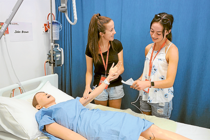 THE MAKING OF NEW DOCTORS… From left, new Bachelor of Biomedical Science (Medical) students and local residents, Ella Sprunt and Gabriella Hill. Photo: Supplied.