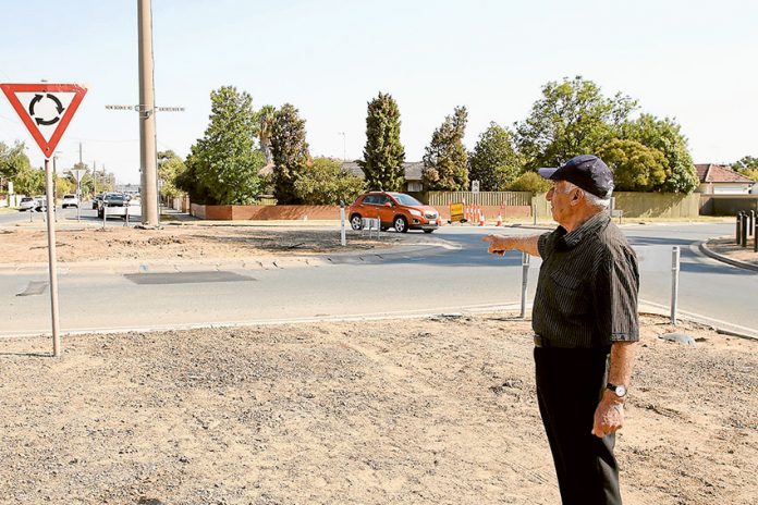 ED---Verney-Balaclava-roundabout TRAVELLING A ROAD OF MEMORIES… Local resident, John Meola at the Balaclava and Verney Road roundabout, which he worked on installing in 1977. Photo: David Lee.