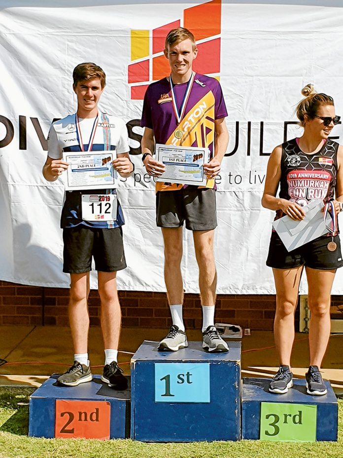 COURSE RECORD BROKEN... Shepparton Runners Club member, Nathan Stoate middle) who took first place and set a new course record at the 5km Numurkah Fun Run on Sunday. Photo: Supplied.
