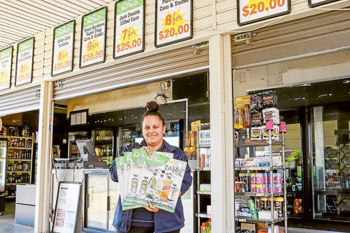 DRIVE-THRU TO GRAB SOME BARGAINS… Bottle-O Mooroopna manager, Ash Simpson says it’s business as usual as the renovations on the convenient location near completion. Photo: Katelyn Morse.