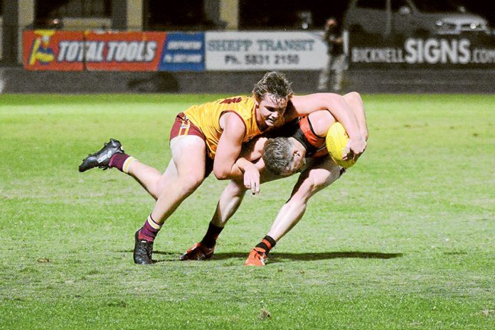 A GREAT START TO THE SEASON… There have been a number of close games in the first two rounds of this year’s GVL senior football. Pictured, Riley Ironside (Kyabram) and Matt Ryan (Shepparton). Photo: Bailey Opie Photography.