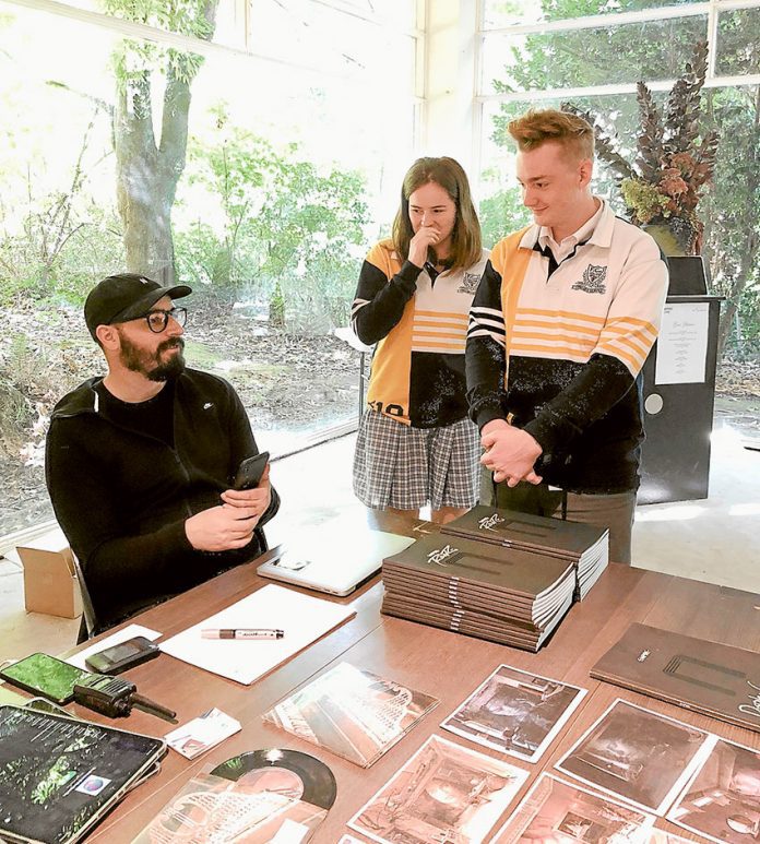 YTYN---RONE-exhibit AN ARTY TOUR… From left, highly acclaimed international street artist, RONE with students from FCJ College Benalla who were two of 40 to travel to RONE’s iconic Art Moderne mansion and estate located in Sherbrooke, Dandenong Ranges. Photo: Supplied.