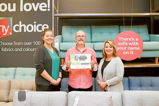 FANTASTIC FURNITURE&hellip; From left, GMCU Shepparton member services officer, Maddison Schultz, 2019 GMCU $30,000 Giveaway $1,000 staff prize winner, Wayne Tomlin and The Adviser advertising manager, Melanie Spencer. Photo: Katelyn Morse.