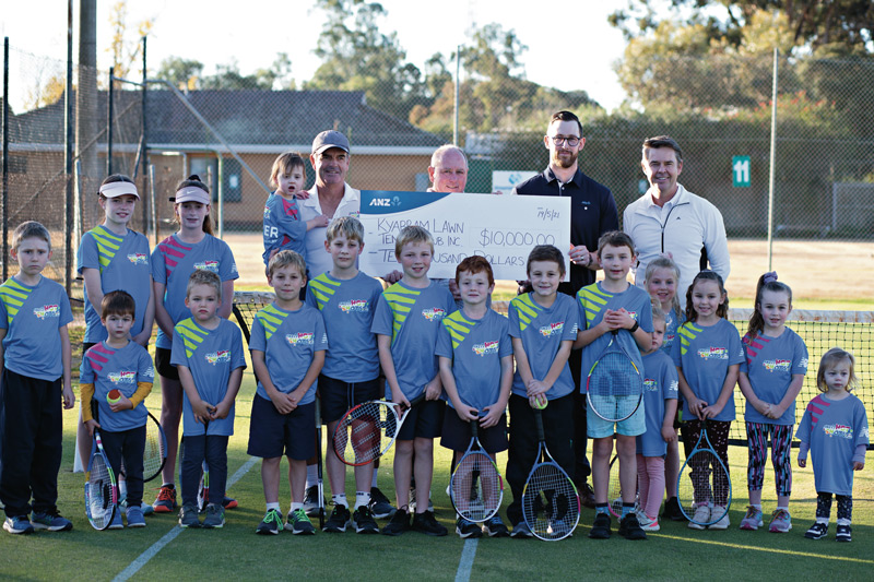 GOOD SERVE... Kyabram Tennis Club community members with ANZ Shepparton branch manager, Michael Harbor and Australian tennis legend, Todd Woodbridge. Photo: Supplied