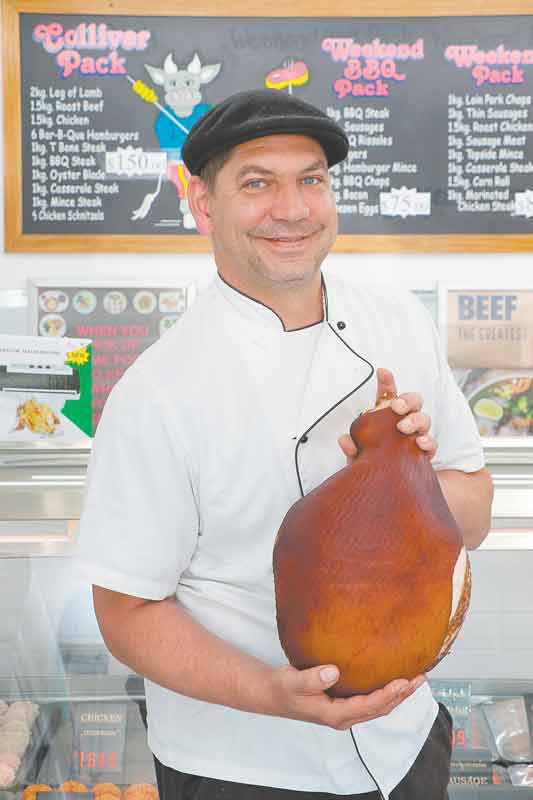 ADV---KRUEGERS-MEATS-1 CHRISTMAS READY... Place your order now at Krueger’s Fine Meats and Smallgoods. Pictured: Krueger’s Fine Meats and Smallgoods owner, Martin Krueger. Photo: Alicia Niglia