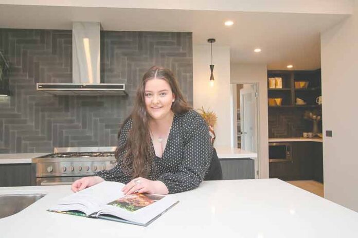 DESIGN FROM HOME... Using an online tool, you can design your dream home. Pictured is Simonds Homes sales cadet, Sinead Simkin in one of the beautiful homes on display in Kialla. Photo: Kelly Lucas
